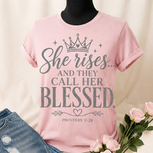 Load image into Gallery viewer, Pink T-shirt with She rises and they call her blessed Proverbs 31:28 design in silver