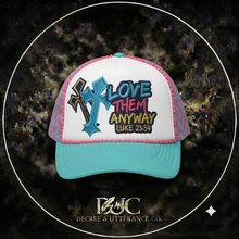 Load image into Gallery viewer, Turquoise and pink trucker hat with Love Them Anyway, cross, and Luke 23:34 design